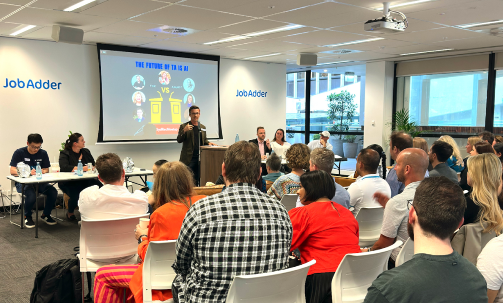A speaker giving presentation to the staff in a meeting room
